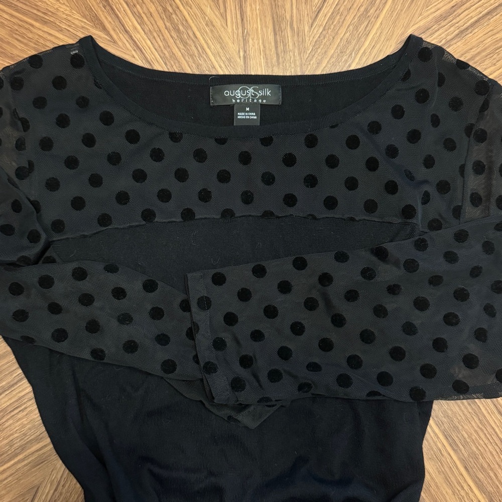 August Silk size M lightweight sweater with sheer panels.